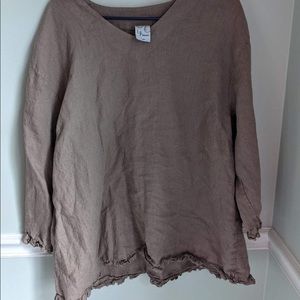 Brown top perfect for fall with ruffles at bottom.